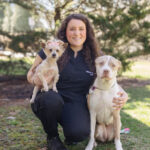 Marissa outside with a yorkie and pitt